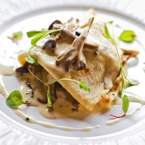 The lump crab and mushroom crêpe in beurre blanc served at Restaurant Lorena's